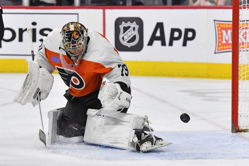 Jan 8, 2024; Philadelphia, Pennsylvania, USA;  Philadelphia Flyers goaltender Carter Hart (79) makes a save against the Pittsburgh Penguins during the second period at Wells Fargo Center. Mandatory Credit: Eric Hartline-USA TODAY Sports