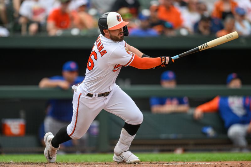 Aug 6, 2023; Baltimore, Maryland, USA; Baltimore Orioles right fielder Ryan McKenna (26) hits a double during the seventh inning against the New York Mets at Oriole Park at Camden Yards. Mandatory Credit: Reggie Hildred-USA TODAY Sports