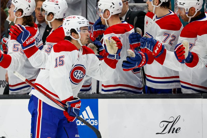 Mar 24, 2024; Seattle, Washington, USA; Montreal Canadiens center Alex Newhook (15) high-fives teammates on the bench after scoring a goal against the Seattle Kraken during the first period at Climate Pledge Arena. Mandatory Credit: Joe Nicholson-USA TODAY Sports