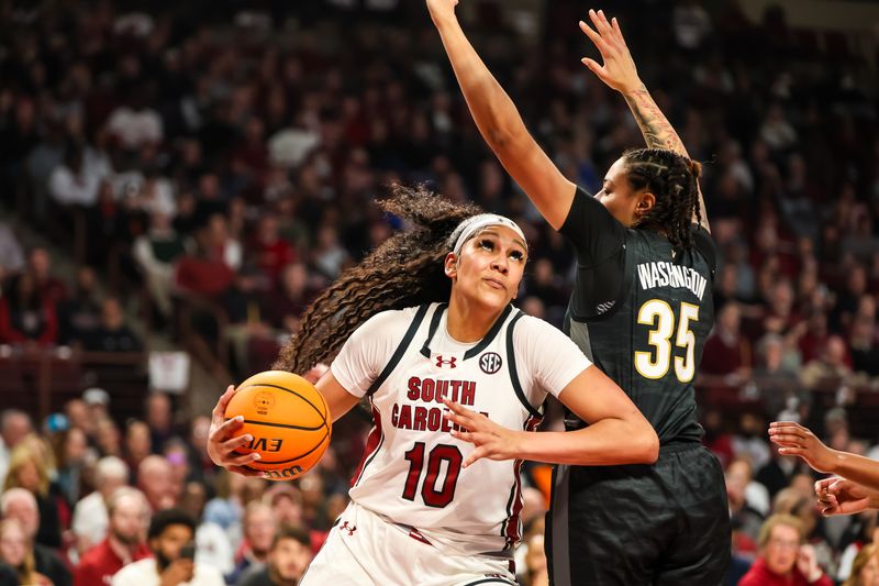 Jan 28, 2024; Columbia, South Carolina, USA; South Carolina Gamecocks center Kamilla Cardoso (10) drives around Vanderbilt Commodores forward Sacha Washington (35) in the first half at Colonial Life Arena. Mandatory Credit: Jeff Blake-USA TODAY Sports