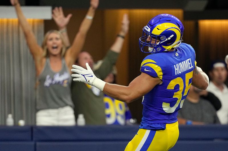 Los Angeles Rams linebacker Jacob Hummel runs an interception back for a touchdown during the first half of a preseason NFL football game against the Las Vegas Raiders Saturday, Aug. 19, 2023, in Inglewood, Calif. (AP Photo/Mark J. Terrill)