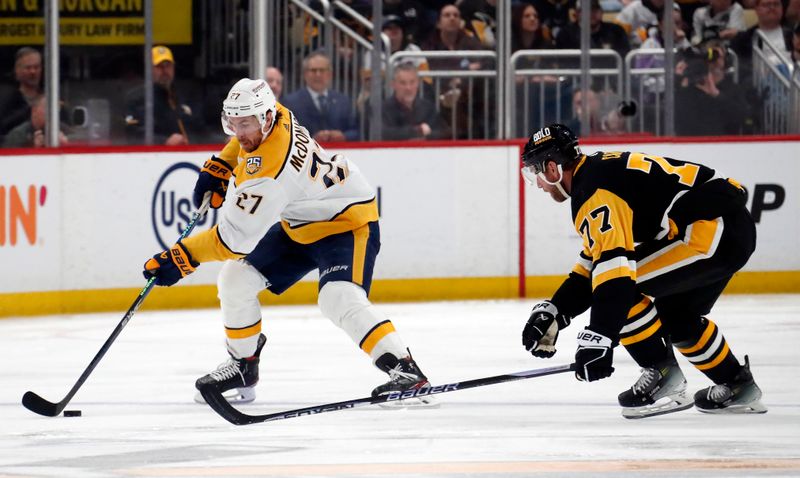 Apr 15, 2024; Pittsburgh, Pennsylvania, USA;  Nashville Predators defenseman Ryan McDonagh (27) move the puck against Pittsburgh Penguins center Jeff Carter (77) during the second period at PPG Paints Arena. Mandatory Credit: Charles LeClaire-USA TODAY Sports