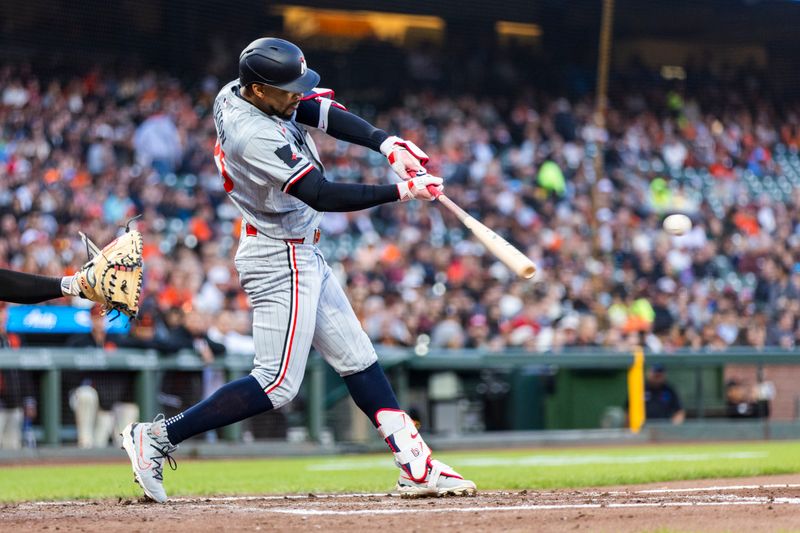 Jul 12, 2024; San Francisco, California, USA; Minnesota Twins center fielder Byron Buxton (25) hits a single against the San Francisco Giants during the fourth inning at Oracle Park. Mandatory Credit: John Hefti-USA TODAY Sports