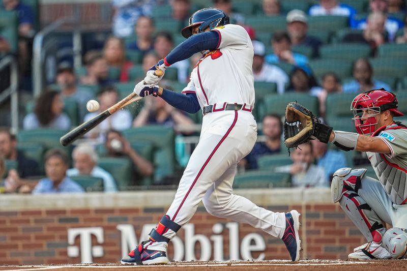 Aug 20, 2024; Cumberland, Georgia, USA; Atlanta Braves right fielder Ramon Laureano (18) gets a broken bat base hit against the Philadelphia Phillies during the first inning at Truist Park. Mandatory Credit: Dale Zanine-USA TODAY Sports