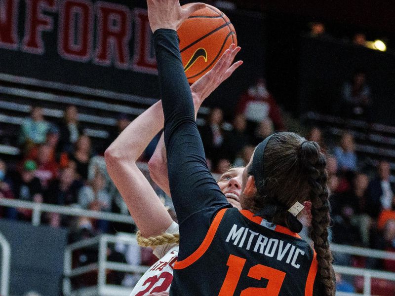 Jan 27, 2023; Stanford, California, USA; Stanford Cardinal forward Cameron Brink (22) shoots the basketball against Oregon State Beavers forward Jelena Mitrovic (12) during the first quarter at Maples Pavilion. Mandatory Credit: Neville E. Guard-USA TODAY Sports