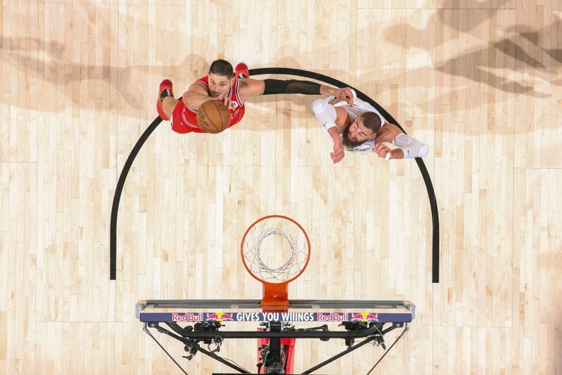 NEW ORLEANS, LA - FEBRUARY 25: Nikola Vucevic #9 of the Chicago Bulls grabs the rebound during the game against the New Orleans Pelicans on February 25, 2024 at the Smoothie King Center in New Orleans, Louisiana. NOTE TO USER: User expressly acknowledges and agrees that, by downloading and or using this Photograph, user is consenting to the terms and conditions of the Getty Images License Agreement. Mandatory Copyright Notice: Copyright 2024 NBAE (Photo by Layne Murdoch Jr./NBAE via Getty Images)