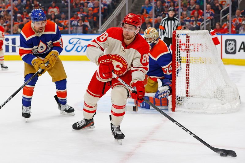 Feb 24, 2024; Edmonton, Alberta, CAN; Calgary Flames forward Andrew Mangiapane (88) looks to make a pass in front of Edmonton Oilers defensemen Cody Ceci (5) and goaltender Stuart Skinner (74) during the second period at Rogers Place. Mandatory Credit: Perry Nelson-USA TODAY Sports