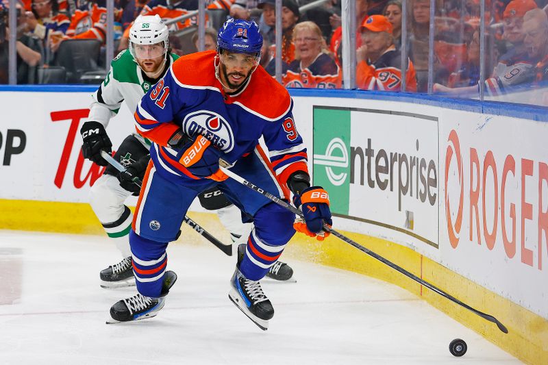 May 29, 2024; Edmonton, Alberta, CAN; Edmonton Oilers forward Evander Kane (91) looks to make a pass in front of Dallas Stars defensemen Thomas Harley (55) during the third period in game four of the Western Conference Final of the 2024 Stanley Cup Playoffs at Rogers Place. Mandatory Credit: Perry Nelson-USA TODAY Sports