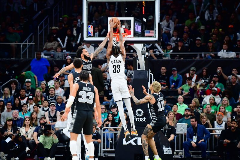 AUSTIN, TX - MARCH 17: Nicolas Claxton #33 of the Brooklyn Nets dunks the ball during the game against the San Antonio Spurs on March 17, 2024 at the Moody Center in Austin, Texas. NOTE TO USER: User expressly acknowledges and agrees that, by downloading and or using this photograph, user is consenting to the terms and conditions of the Getty Images License Agreement. Mandatory Copyright Notice: Copyright 2024 NBAE (Photos by Michael Gonzales/NBAE via Getty Images)