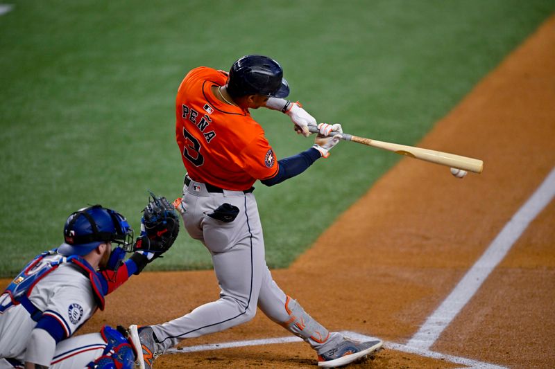 Aug 7, 2024; Arlington, Texas, USA;  Houston Astros shortstop Jeremy Pena (3) drives in a run against the Texas Rangers during the first inning at Globe Life Field. Mandatory Credit: Jerome Miron-USA TODAY Sports