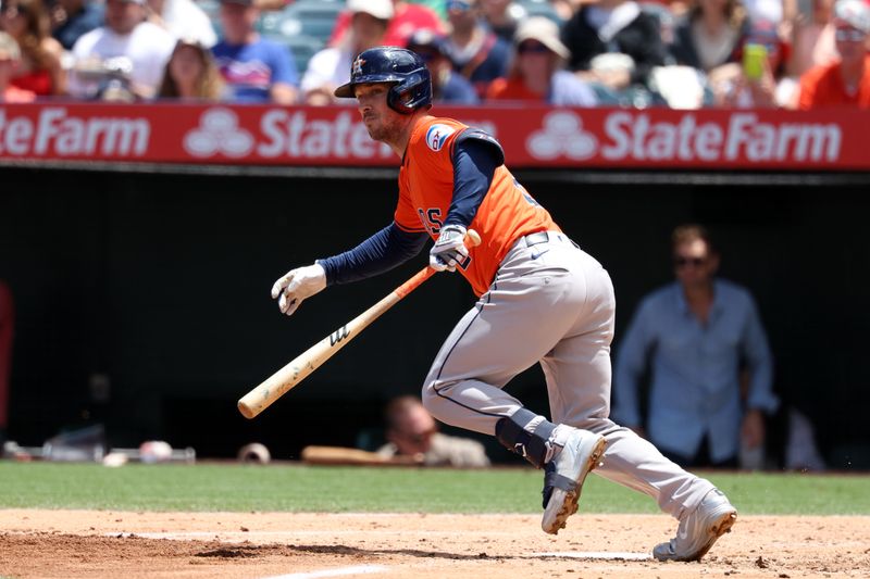 Jun 9, 2024; Anaheim, California, USA;  Houston Astros third baseman Alex Bregman (2) hits an RBI double during the third inning against the Los Angeles Angels at Angel Stadium. Mandatory Credit: Kiyoshi Mio-USA TODAY Sports