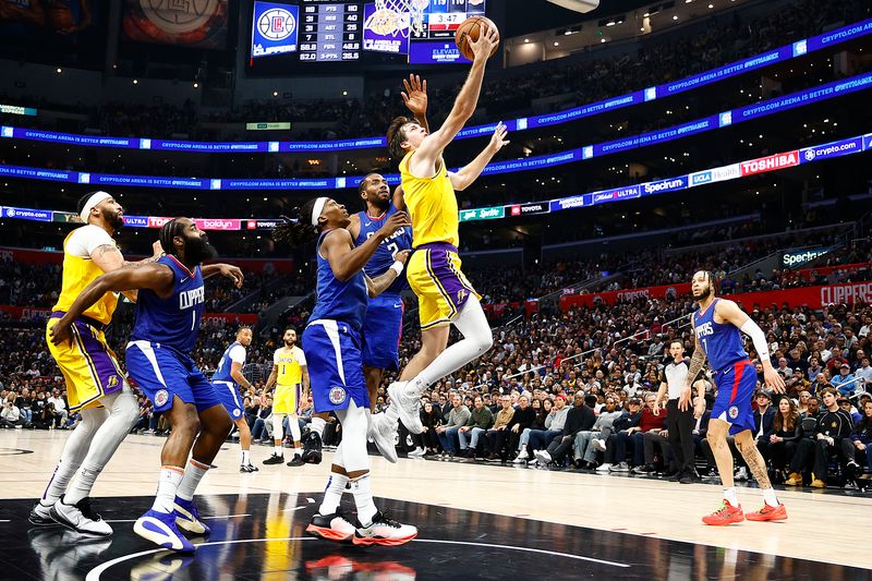 LOS ANGELES, CALIFORNIA - JANUARY 23:  Austin Reaves #15 of the Los Angeles Lakers takes a shot against the LA Clippers in the second half at Crypto.com Arena on January 23, 2024 in Los Angeles, California.  NOTE TO USER: User expressly acknowledges and agrees that, by downloading and/or using this photograph, user is consenting to the terms and conditions of the Getty Images License Agreement.  (Photo by Ronald Martinez/Getty Images)