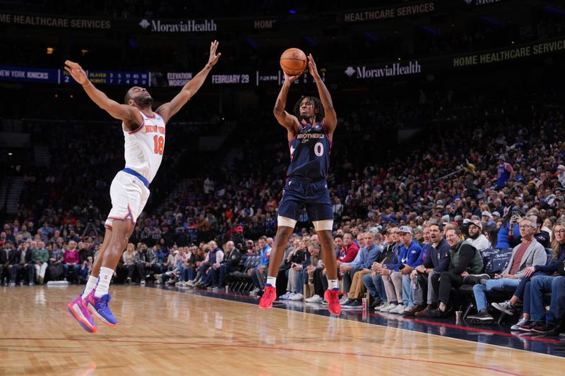 PHILADELPHIA, PA - FEBRUARY 22: Tyrese Maxey #0 of the Philadelphia 76ers shoots a three point basket against the New York Knicks on February 22, 2024 at the Wells Fargo Center in Philadelphia, Pennsylvania NOTE TO USER: User expressly acknowledges and agrees that, by downloading and/or using this Photograph, user is consenting to the terms and conditions of the Getty Images License Agreement. Mandatory Copyright Notice: Copyright 2024 NBAE (Photo by Jesse D. Garrabrant/NBAE via Getty Images)