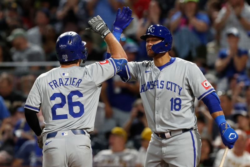 Sep 13, 2024; Pittsburgh, Pennsylvania, USA;  Kansas City Royals first baseman Yuli Gurriel (18) greets third baseman Adam Frazier (26) crossing home plate on a solo home run against the Pittsburgh Pirates during the eighth inning at PNC Park. Mandatory Credit: Charles LeClaire-Imagn Images