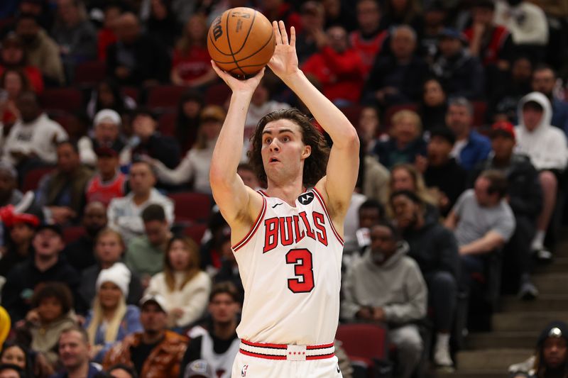 CHICAGO, ILLINOIS - OCTOBER 16: Josh Giddey #3 of the Chicago Bulls shoots a three pointer against the Minnesota Timberwolves during the first half of a preseason game at the United Center on October 16, 2024 in Chicago, Illinois. NOTE TO USER: User expressly acknowledges and agrees that, by downloading and or using this photograph, User is consenting to the terms and conditions of the Getty Images License Agreement.  (Photo by Michael Reaves/Getty Images)