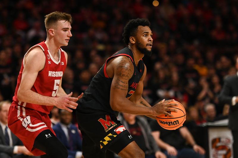 Jan 25, 2023; College Park, Maryland, USA;  Maryland Terrapins forward Donta Scott (24)] looks to shoots as Wisconsin Badgers forward Tyler Wahl (5) defends during the second half at Xfinity Center. Mandatory Credit: Tommy Gilligan-USA TODAY Sports