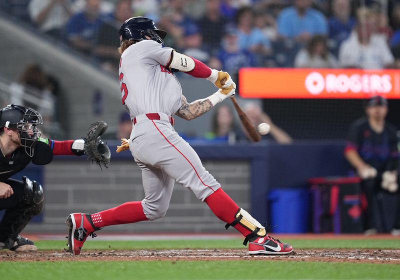 Jun 19, 2024; Toronto, Ontario, CAN; Boston Red Sox left fielder Jarren Duran (16) hits an RBI single against the Toronto Blue Jays during the sixth inning at Rogers Centre. Mandatory Credit: Nick Turchiaro-USA TODAY Sports