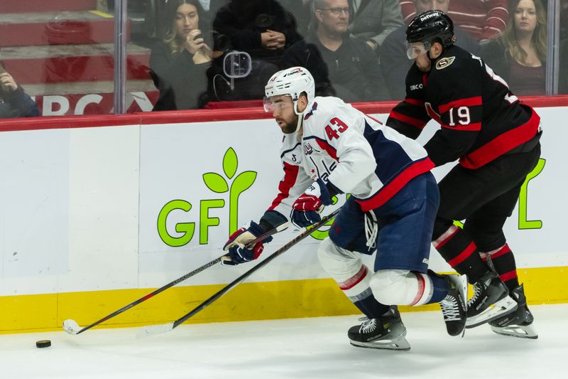 Jan 16, 2025; Ottawa, Ontario, CAN; Washington Capitals right wing Tom Wilson (43) skates with the puck in front of Ottawa Senators right wing Drake Batherson (19) in the third period at the Canadian Tire Centre. Mandatory Credit: Marc DesRosiers-Imagn Images