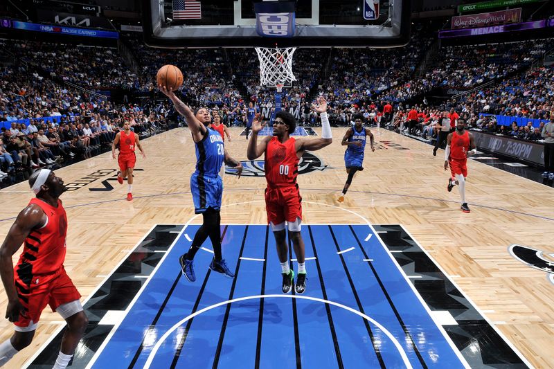 ORLANDO, FL - APRIL 1: Markelle Fultz #20 of the Orlando Magic drives to the basket during the game against the Portland Trail Blazers on April 1, 2024 at Kia Center in Orlando, Florida. NOTE TO USER: User expressly acknowledges and agrees that, by downloading and or using this photograph, User is consenting to the terms and conditions of the Getty Images License Agreement. Mandatory Copyright Notice: Copyright 2024 NBAE (Photo by Fernando Medina/NBAE via Getty Images)