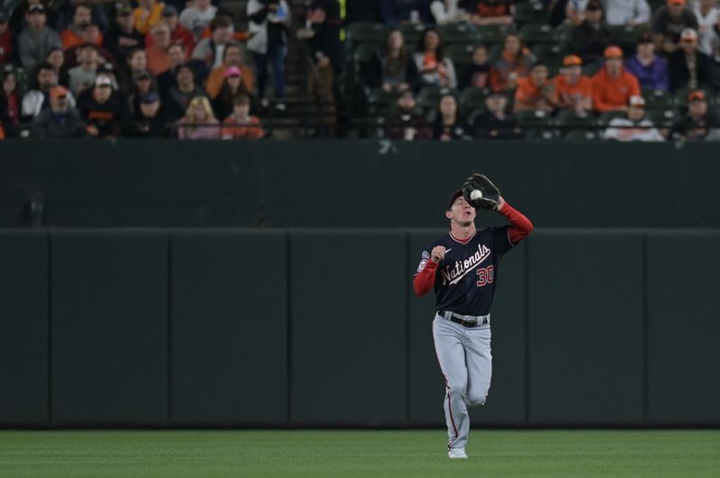 Sep 26, 2023; Baltimore, Maryland, USA;  Washington Nationals outfielder Jacob Young (30) catches a second inning fly ball against the Baltimore Orioles at Oriole Park at Camden Yards. Mandatory Credit: Tommy Gilligan-USA TODAY Sports