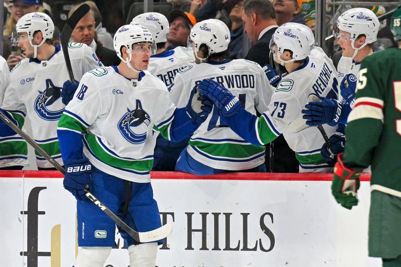 Nov 1, 2025; Saint Paul, Minnesota, USA;  Vancouver Canucks forward Drew O'Connor (18) celebrates his goal against the Minnesota Wild during the second period at Grand Casino Arena. Mandatory Credit: Nick Wosika-Imagn Images