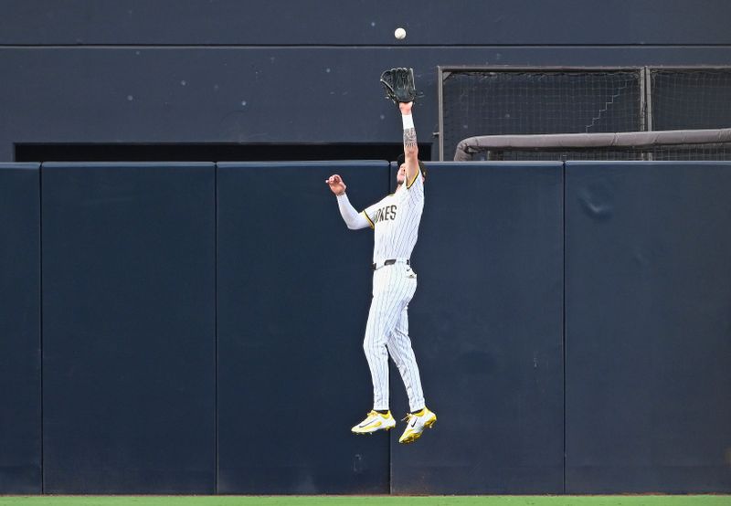 Sep 10, 2025; San Diego, California, USA; San Diego Padres center fielder Jackson Merrill (3) makes the catch on a ball hit by Cincinnati Reds third baseman Noelvi Marte (not pictured) during the first inning at Petco Park. Mandatory Credit: Denis Poroy-Imagn Images