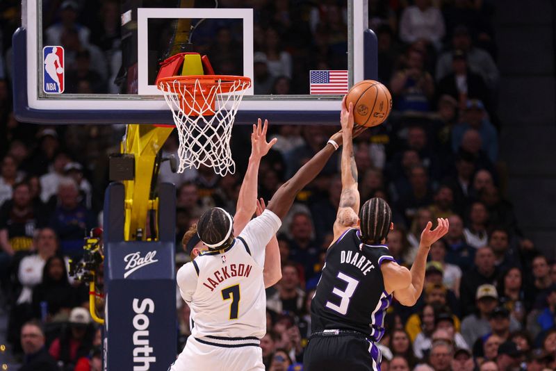 DENVER, COLORADO - FEBRUARY 28: Chris Duarte #3 of the Sacramento Kings goes for a lay up against Reggie Jackson #7 of the Denver Nuggets during the first quarter at Ball Arena on February 28, 2024 in Denver, Colorado. NOTE TO USER: User expressly acknowledges and agrees that, by downloading and or using this photograph, User is consenting to the terms and conditions of the Getty Images License Agreement. (Photo by Alysa Rubin/Clarkson Creative/Getty Images)