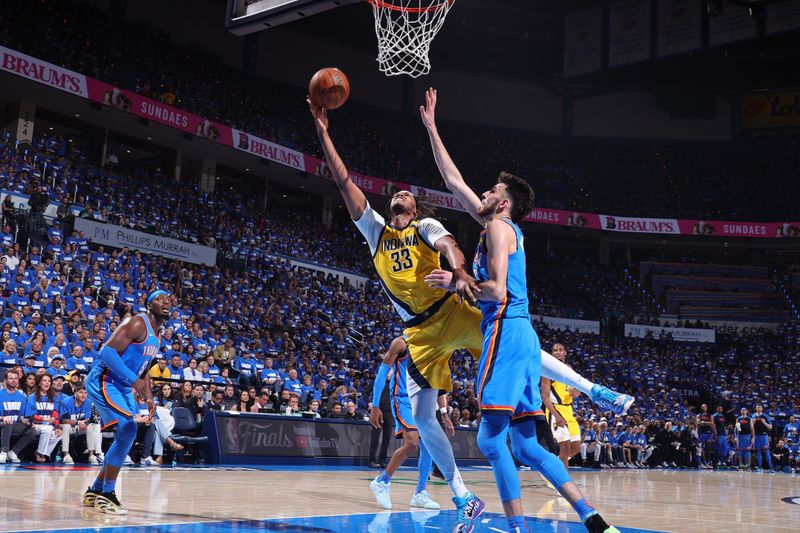 OKLAHOMA CITY, OK - JUNE 8: Myles Turner #33 of the Indiana Pacers drives to the basket during the game against the Oklahoma City Thunder during Game Two of the 2025 NBA Finals on June 8, 2025 at Paycom Center in Oklahoma City, Oklahoma. NOTE TO USER: User expressly acknowledges and agrees that, by downloading and or using this photograph, User is consenting to the terms and conditions of the Getty Images License Agreement. Mandatory Copyright Notice: Copyright 2025 NBAE(Photo by Nathaniel S. Butler/NBAE via Getty Images)