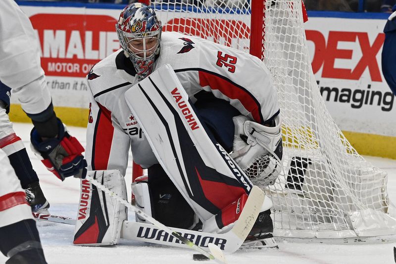 Mar 30, 2023; Tampa, Florida, USA; Washington Capitals goalie Darcy Kuemper (35) tracks the puck in the first period against the Tampa Bay Lightning  at Amalie Arena. Mandatory Credit: Jonathan Dyer-USA TODAY Sports