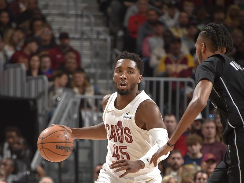 CLEVELAND, OH - NOVEMBER 9: Donovan Mitchell #45 of the Cleveland Cavaliers brings the ball up court during the game against the Brooklyn Nets on November 9, 2024 at Rocket Mortgage FieldHouse in Cleveland, Ohio. NOTE TO USER: User expressly acknowledges and agrees that, by downloading and/or using this Photograph, user is consenting to the terms and conditions of the Getty Images License Agreement. Mandatory Copyright Notice: Copyright 2024 NBAE (Photo by David Liam Kyle/NBAE via Getty Images)