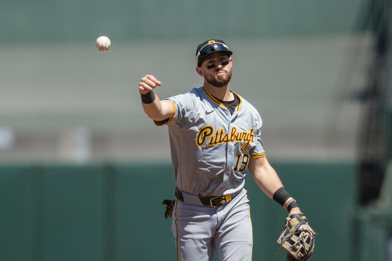 Apr 28, 2024; San Francisco, California, USA;  Pittsburgh Pirates second baseman Jared Triolo (19) throws to first base for an out  against the San Francisco Giants during the sixth inning at Oracle Park. Mandatory Credit: John Hefti-USA TODAY Sports