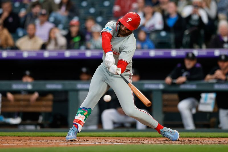 May 19, 2025; Denver, Colorado, USA; Philadelphia Phillies first baseman Bryce Harper (3) hits ban RBI single in the fifth inning against the Colorado Rockies at Coors Field. Mandatory Credit: Isaiah J. Downing-Imagn Images