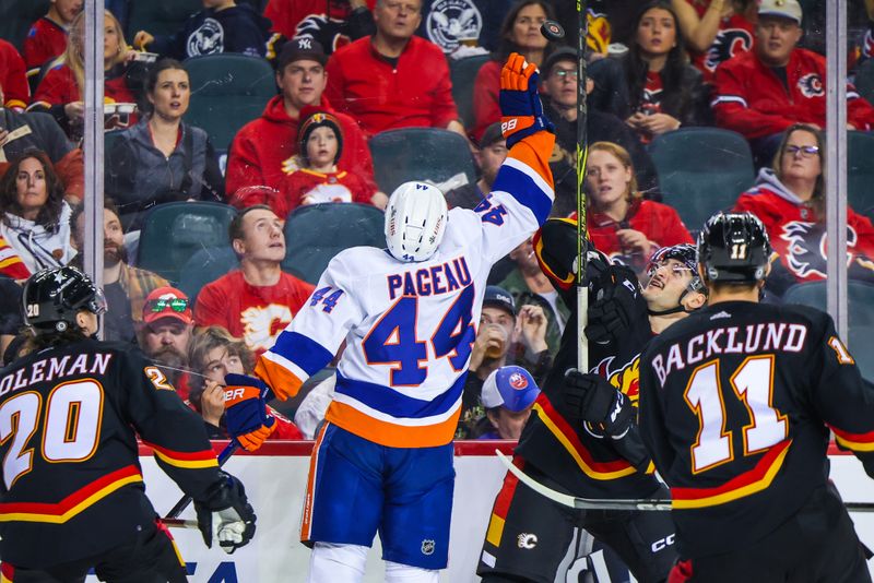 Nov 18, 2023; Calgary, Alberta, CAN; New York Islanders center Jean-Gabriel Pageau (44) and Calgary Flames defenseman Nick DeSimone (57) battle for the puck during the second period at Scotiabank Saddledome. Mandatory Credit: Sergei Belski-USA TODAY Sports