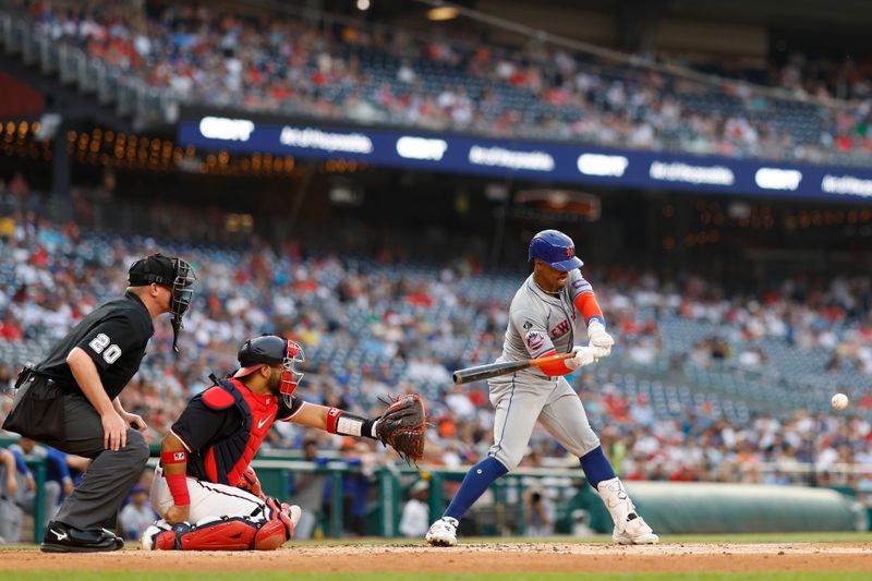 Jun 4, 2024; Washington, District of Columbia, USA; New York Mets shortstop Francisco Lindor (12) singles against the Washington Nationals during the third inning at Nationals Park. Mandatory Credit: Geoff Burke-USA TODAY Sports