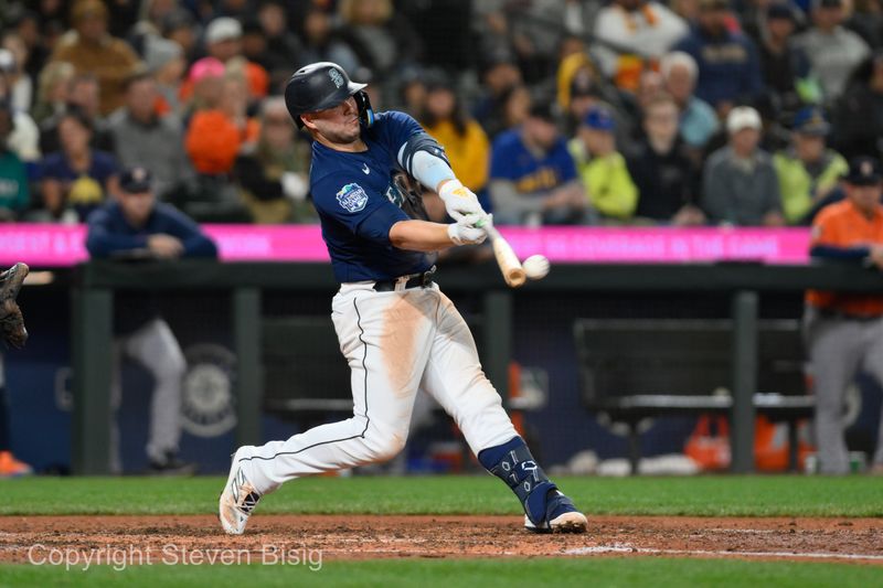 Sep 27, 2023; Seattle, Washington, USA; Seattle Mariners first baseman Ty France (23) hits a single against the Houston Astros during the fifth inning at T-Mobile Park. Mandatory Credit: Steven Bisig-USA TODAY Sports