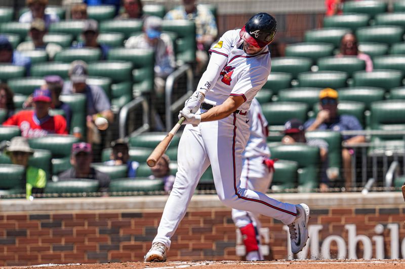 May 20, 2024; Cumberland, Georgia, USA; Atlanta Braves Atlanta Braves first baseman Matt Olson (28) hits a home run against the San Diego Padres during the third inning at Truist Park. Mandatory Credit: Dale Zanine-USA TODAY Sports