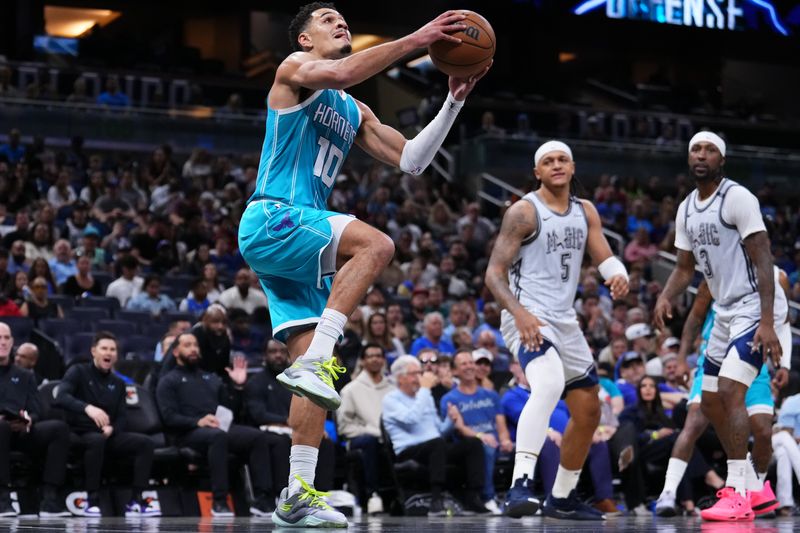 ORLANDO, FLORIDA - FEBRUARY 12: Josh Green #10 of the Charlotte Hornets goes up for a shot against the Orlando Magic during the second quarter at Kia Center on February 12, 2025 in Orlando, Florida. NOTE TO USER: User expressly acknowledges and agrees that, by downloading and or using this photograph, user is consenting to the terms and conditions of the Getty Images License Agreement. (Photo by Rich Storry/Getty Images)