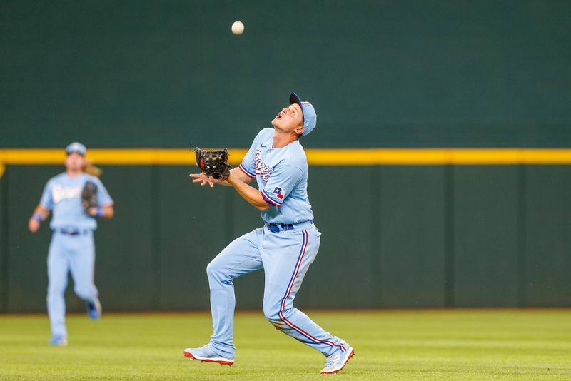 Apr 2, 2023; Arlington, Texas, USA; Texas Rangers shortstop Corey Seager (5) catches the ball during the eighth inning against the Philadelphia Phillies at Globe Life Field. Mandatory Credit: Andrew Dieb-USA TODAY Sports