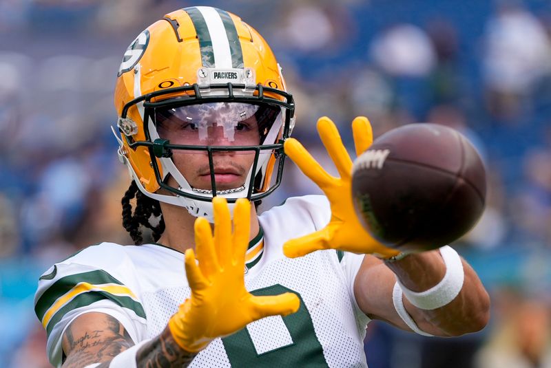 Green Bay Packers' Christian Watson warms up before an NFL football game against the Tennessee Titans Sunday, Sept. 22, 2024, in Nashville, Tenn. (AP Photo/George Walker IV)