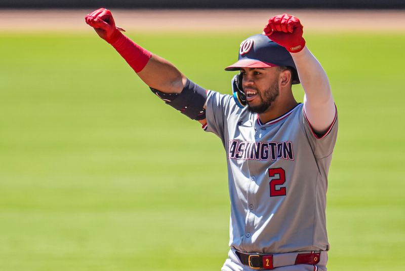 Aug 25, 2024; Cumberland, Georgia, USA; Washington Nationals second baseman Luis Garcia Jr. (2) reacts after getting a base hit against the Atlanta Braves during the first inning at Truist Park. Mandatory Credit: Dale Zanine-USA TODAY Sports