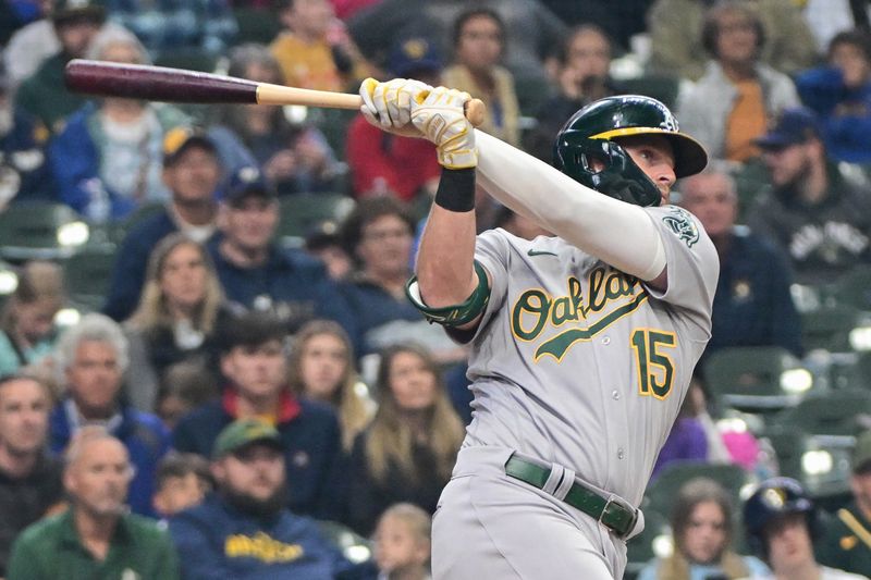 Jun 11, 2023; Milwaukee, Wisconsin, USA; Oakland Athletes left fielder Seth Brown (15) hits a 3-run home run against the Milwaukee Brewers in the fourth inning at American Family Field. Mandatory Credit: Benny Sieu-USA TODAY Sports