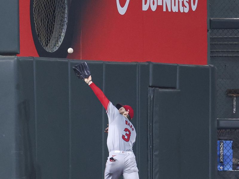 May 22, 2024; Houston, Texas, USA; Los Angeles Angels left fielder Taylor Ward (3) is unable to catch a fly ball hit by Houston Astros designated hitter Yordan Alvarez (not pictured) during the first inning at Minute Maid Park. Mandatory Credit: Troy Taormina-USA TODAY Sports