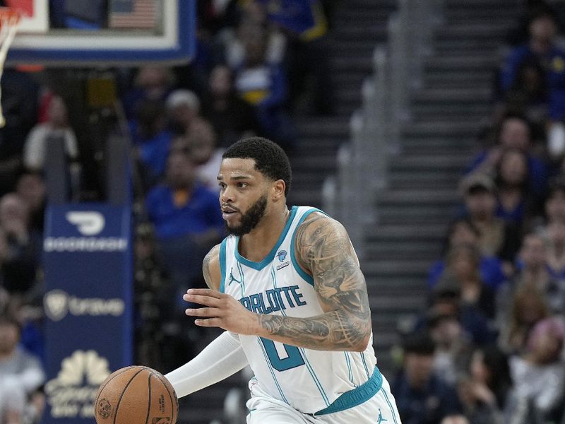 SAN FRANCISCO, CALIFORNIA - FEBRUARY 23: Miles Bridges #0 of the Charlotte Hornets dribbles the ball up court against the Golden State Warriors during the fourth quarter of an NBA basketball game at Chase Center on February 23, 2024 in San Francisco, California. NOTE TO USER: User expressly acknowledges and agrees that, by downloading and or using this photograph, User is consenting to the terms and conditions of the Getty Images License Agreement. (Photo by Thearon W. Henderson/Getty Images)