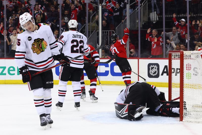 Jan 5, 2024; Newark, New Jersey, USA; New Jersey Devils right wing Alexander Holtz (10) celebrates his goal against the Chicago Blackhawks during the second period at Prudential Center. Mandatory Credit: Ed Mulholland-USA TODAY Sports