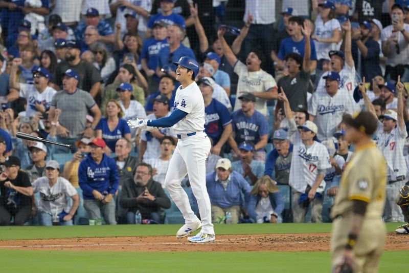 Oct 5, 2024; Los Angeles, California, USA; Los Angeles Dodgers designated hitter Shohei Ohtani (17) scores a homerun against the San Diego Padres during game one of the NLDS for the 2024 MLB Playoffs at Dodger Stadium. Mandatory Credit: Jayne Kamin-Oncea-Imagn Images