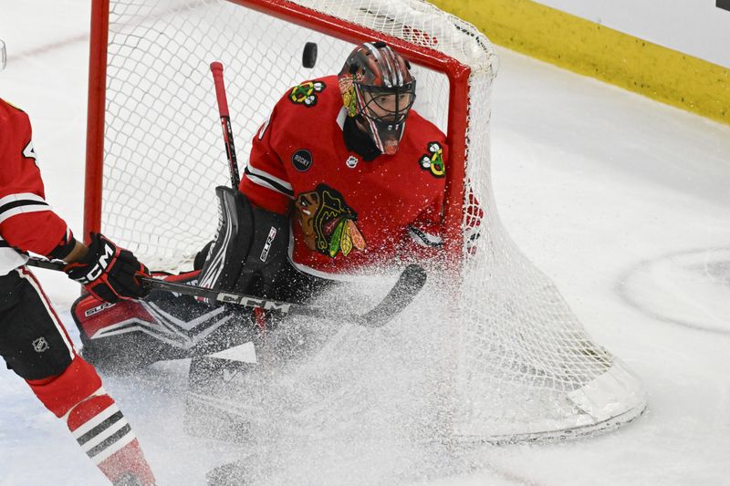 Apr 7, 2024; Chicago, Illinois, USA;  Chicago Blackhawks goaltender Arvid Soderblom (40) looks on as a puck flies by against the Minnesota Wild during the first period at the United Center. Mandatory Credit: Matt Marton-USA TODAY Sports