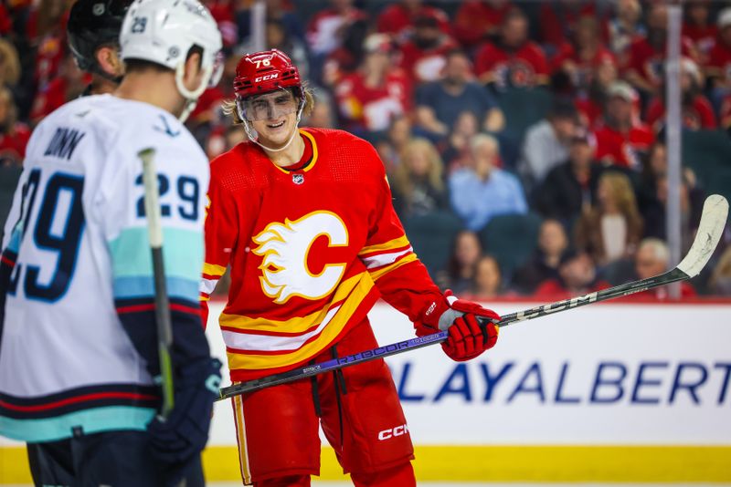 Dec 27, 2023; Calgary, Alberta, CAN; Calgary Flames center Martin Pospisil (76) and Seattle Kraken defenseman Vince Dunn (29) exchanges words during the second period at Scotiabank Saddledome. Mandatory Credit: Sergei Belski-USA TODAY Sports