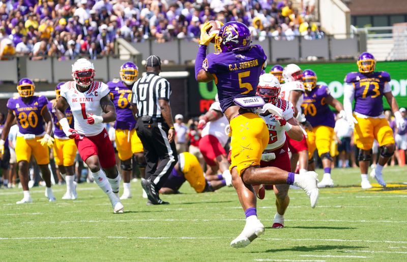 Sep 3, 2022; Greenville, North Carolina, USA;  East Carolina Pirates wide receiver C.J. Johnson (5) makes a touchdown catch against the North Carolina State Wolfpack during the first half at Dowdy-Ficklen Stadium. Mandatory Credit: James Guillory-USA TODAY Sports