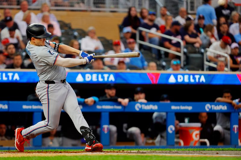 Sep 24, 2024; Minneapolis, Minnesota, USA; Miami Marlins designated hitter Jonah Bride (41) hits a solo home run against the Minnesota Twins in the second inning at Target Field. Mandatory Credit: Bruce Kluckhohn-Imagn Images