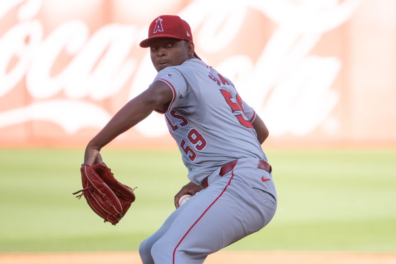 Jul 2, 2024; Oakland, California, USA; Los Angeles Angels pitcher José Soriano (59) pitches against the Oakland Athletics during the first inning at Oakland-Alameda County Coliseum. Mandatory Credit: Ed Szczepanski-USA TODAY Sports